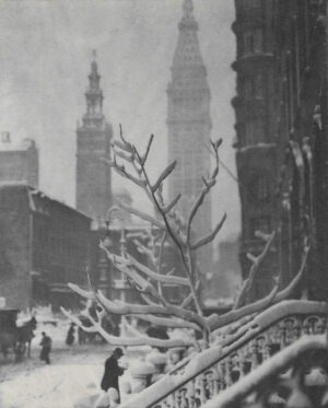 A black and white photo of a snowy city