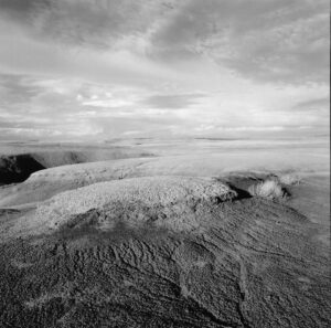A black and white photo of some mountains