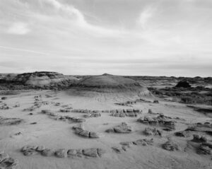 A black and white photo of some sand dunes