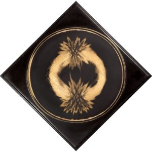 A black and gold circle with two pineapples on it.