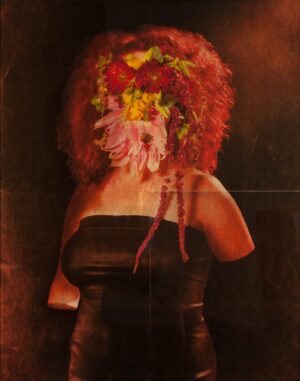 A woman with red hair and flowers in her head.