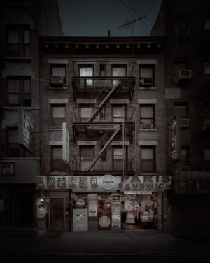 A building with fire escapes on the side of it.