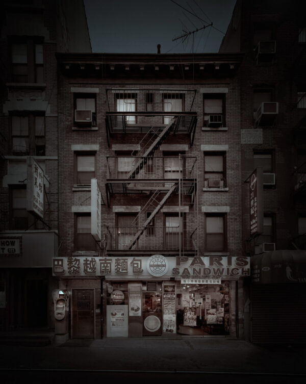 A building with fire escapes on the side of it.