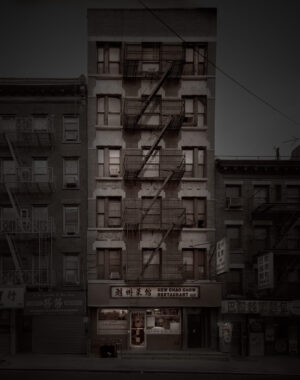 A building with fire escapes on the side of it.