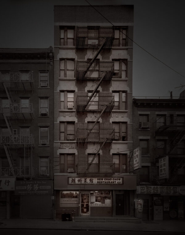 A building with fire escapes on the side of it.