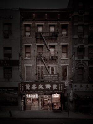 A building with fire escapes on the outside of it.