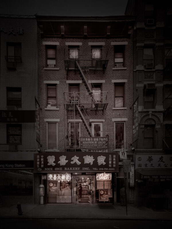 A building with fire escapes on the outside of it.
