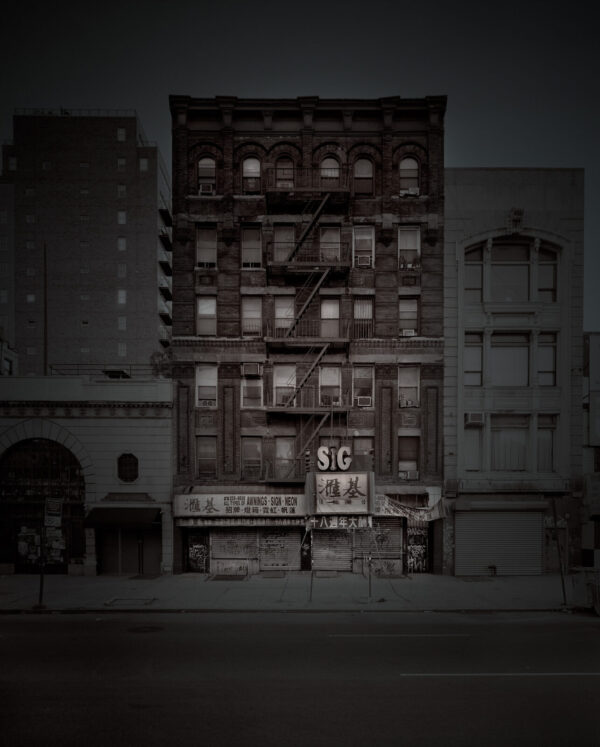 A building with many windows on the side of it.