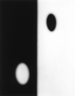 A black and white photo of two circles.