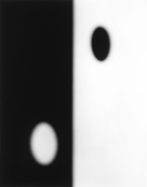 A black and white photo of two circles.