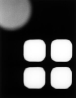 A black and white photo of four squares.