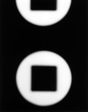 A black and white photo of two circles