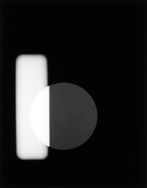 A black and white photo of an object in the dark.