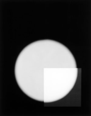 A white ball is shown in the dark.