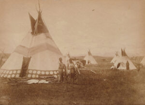 A group of people standing around some tents.