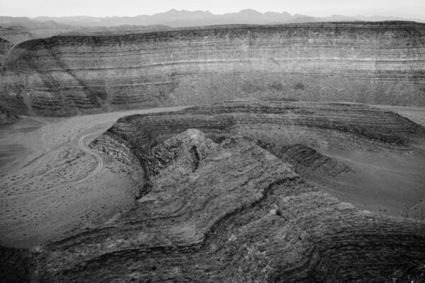 A black and white photo of an open pit.