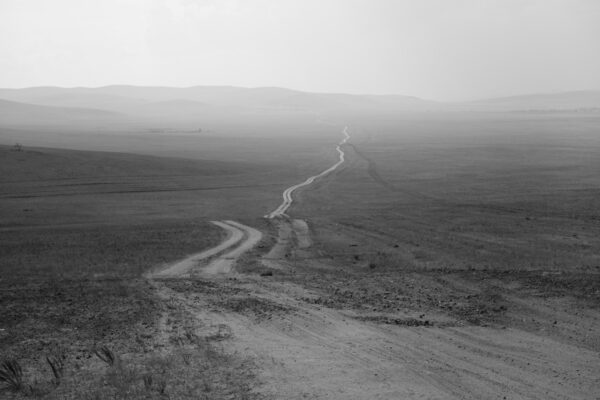 A dirt road going through the middle of nowhere.