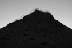 A black and white photo of some mountains