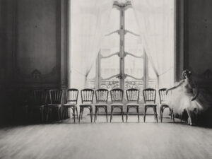 A group of chairs in front of a window.