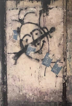 A picture of the face on a wall.