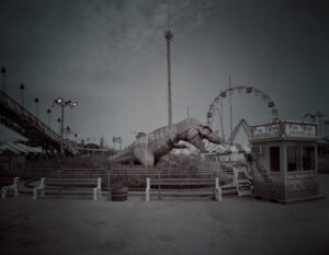 A black and white photo of an amusement park.