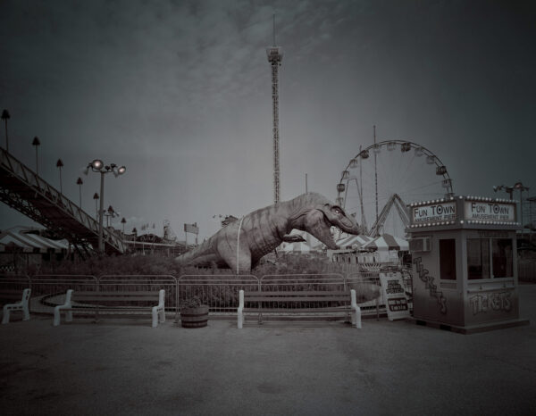 A black and white photo of an amusement park.