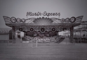 A black and white photo of an amusement park.