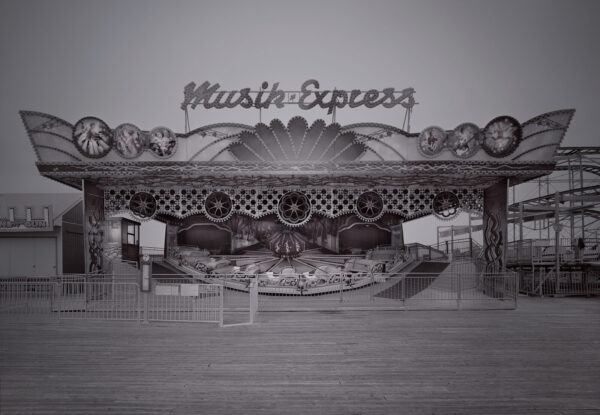 A black and white photo of an amusement park.