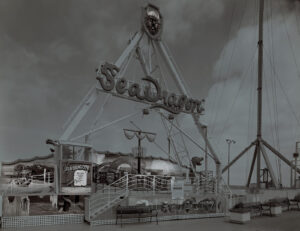 A black and white photo of the entrance to the amusement park.