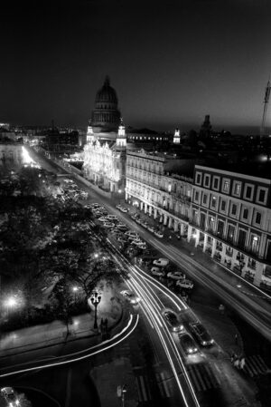 A black and white photo of a city at night.