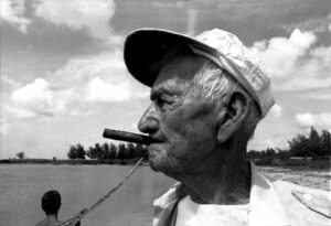 A man with a cigar in his mouth.