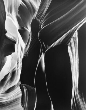 A black and white photo of the interior walls of antelope canyon.