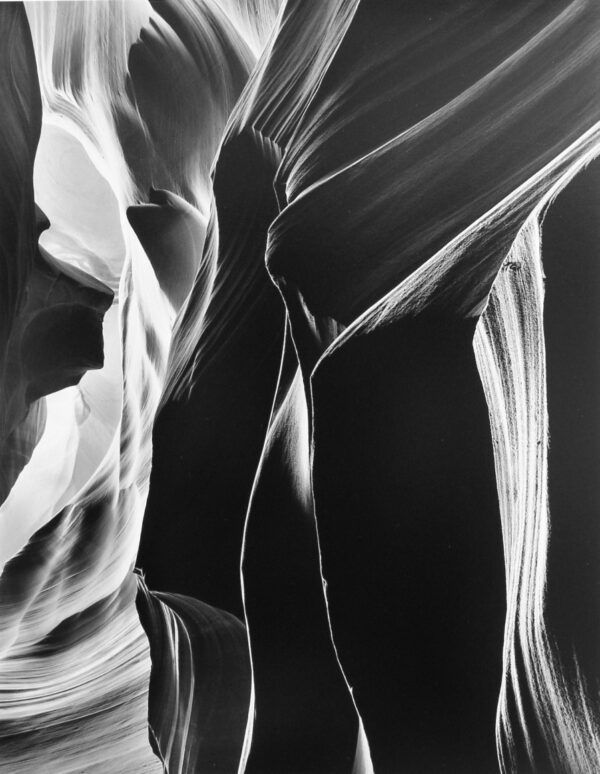 A black and white photo of the interior walls of antelope canyon.
