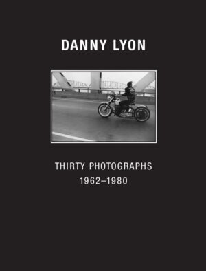 A man riding on the back of a motorcycle.