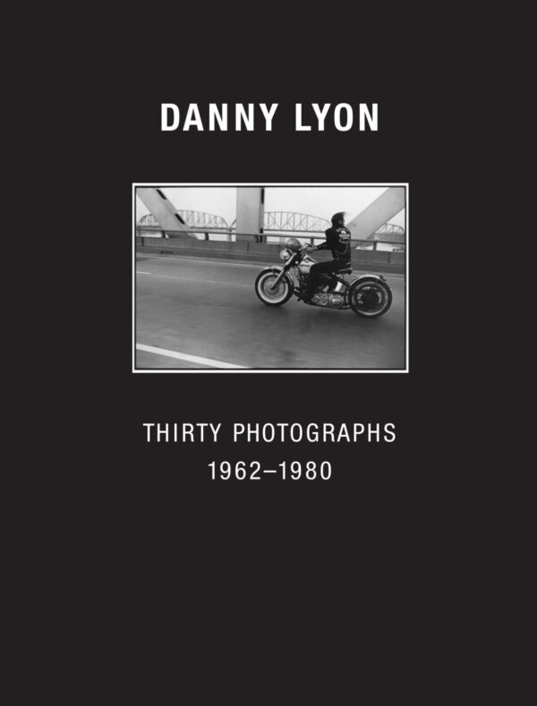 A man riding on the back of a motorcycle.