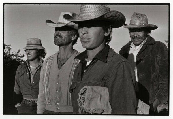 A group of men standing next to each other.