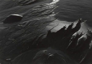 A black and white photo of some water