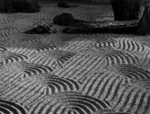 A black and white photo of sand dunes.