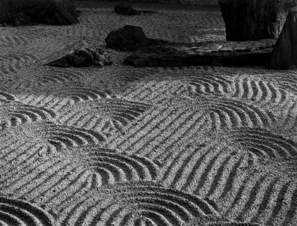 A black and white photo of sand dunes.