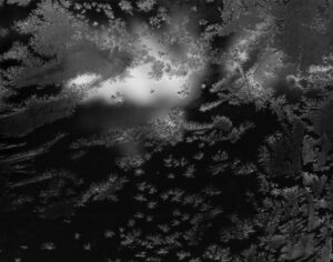 A black and white photo of clouds in the sky.
