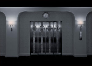A clock is on the wall in front of an elevator.