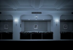 A room with a picture on the wall and lights