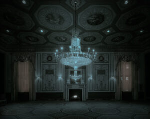 A chandelier in the middle of an empty room.