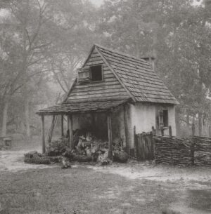 A black and white photo of an old house