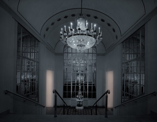 A chandelier hanging from the ceiling of a room.