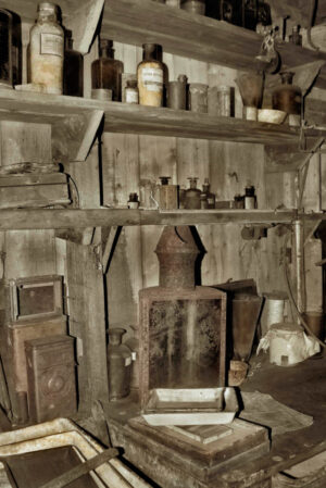 A room with many old items on the shelves.
