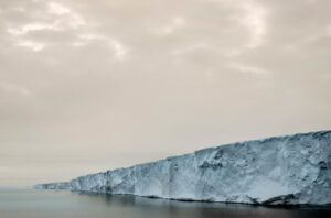 A large piece of ice floating on top of the ocean.