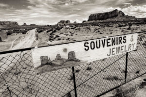 A sign that says souvenirs jewish in black and white.