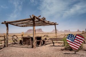A wooden structure with an american flag painted on it.