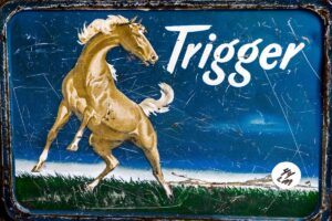 A close up of the side of a sign with a horse